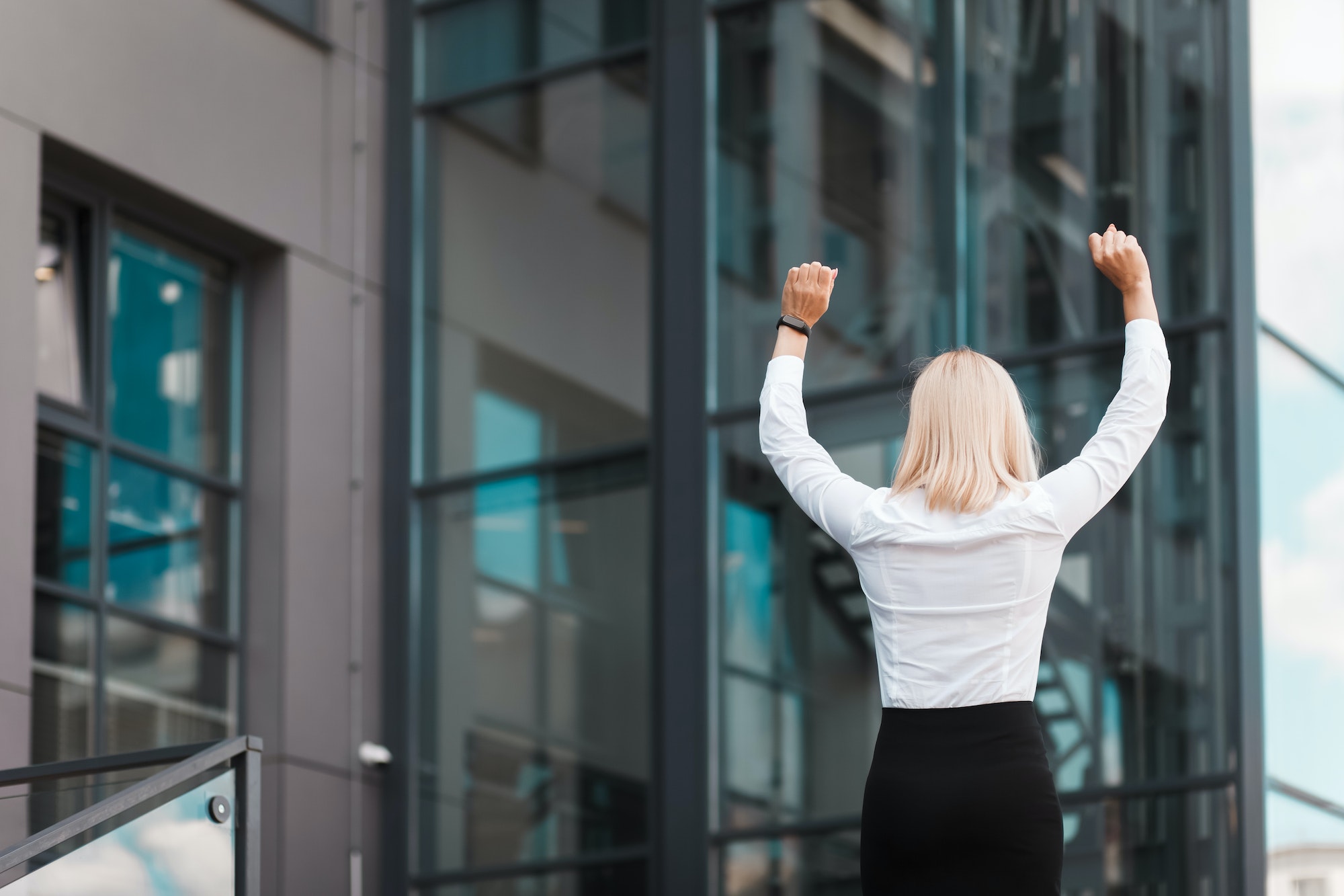 Woman happy about business success.